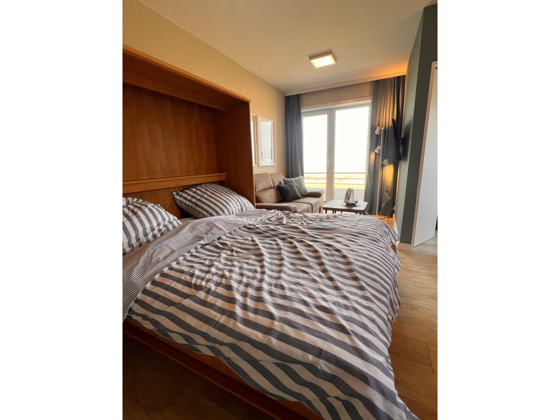 Ferienwohnung NW 42 Balkon mit Meerblick Foto 8